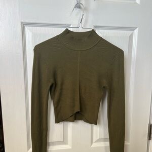 Olive color very cute top for young women. Used once for pictures. From garage